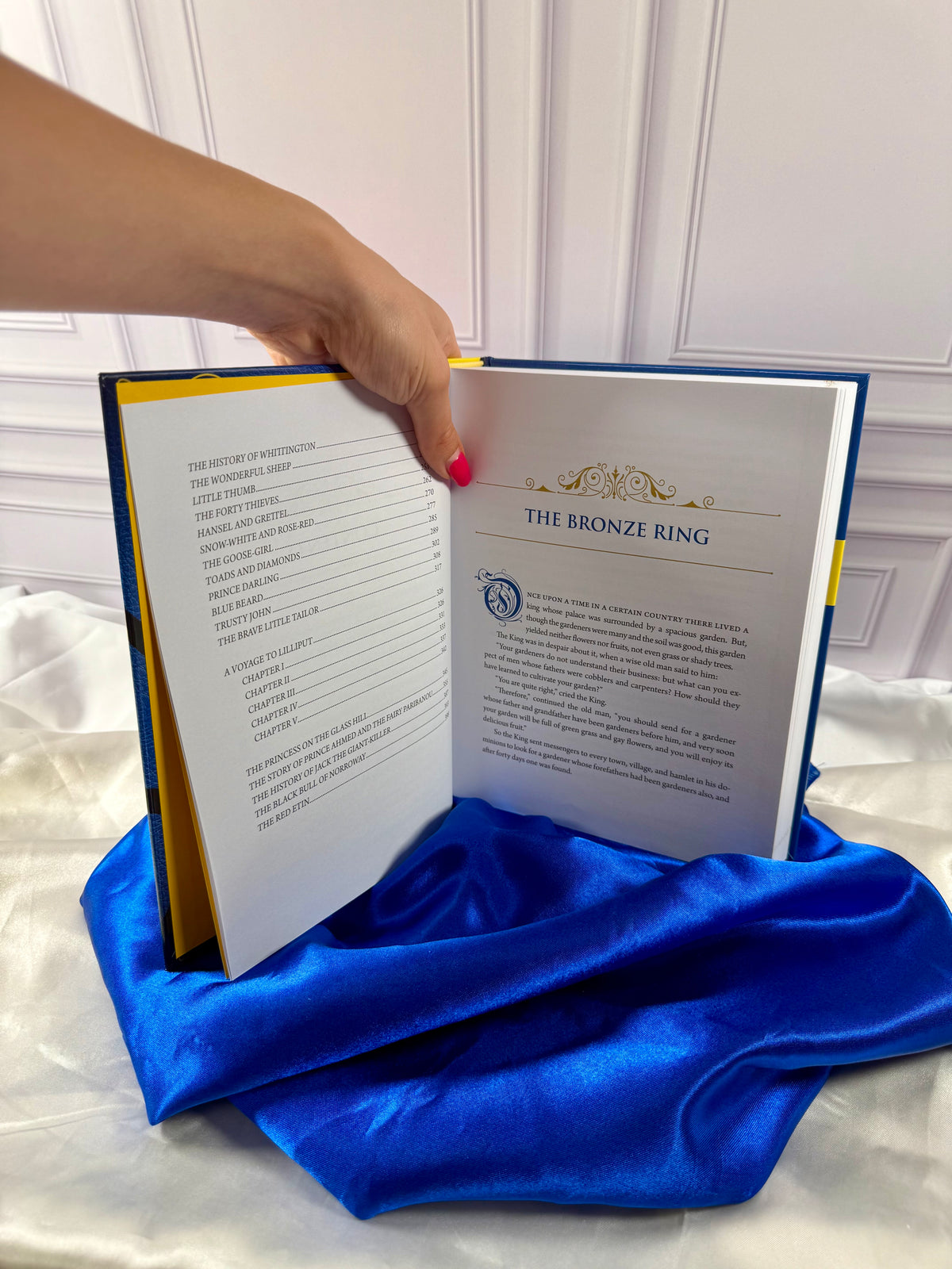 Interior story pages of The Blue Fairy Book by Andrew Lang, showing a classic fairy tale with decorative typography.