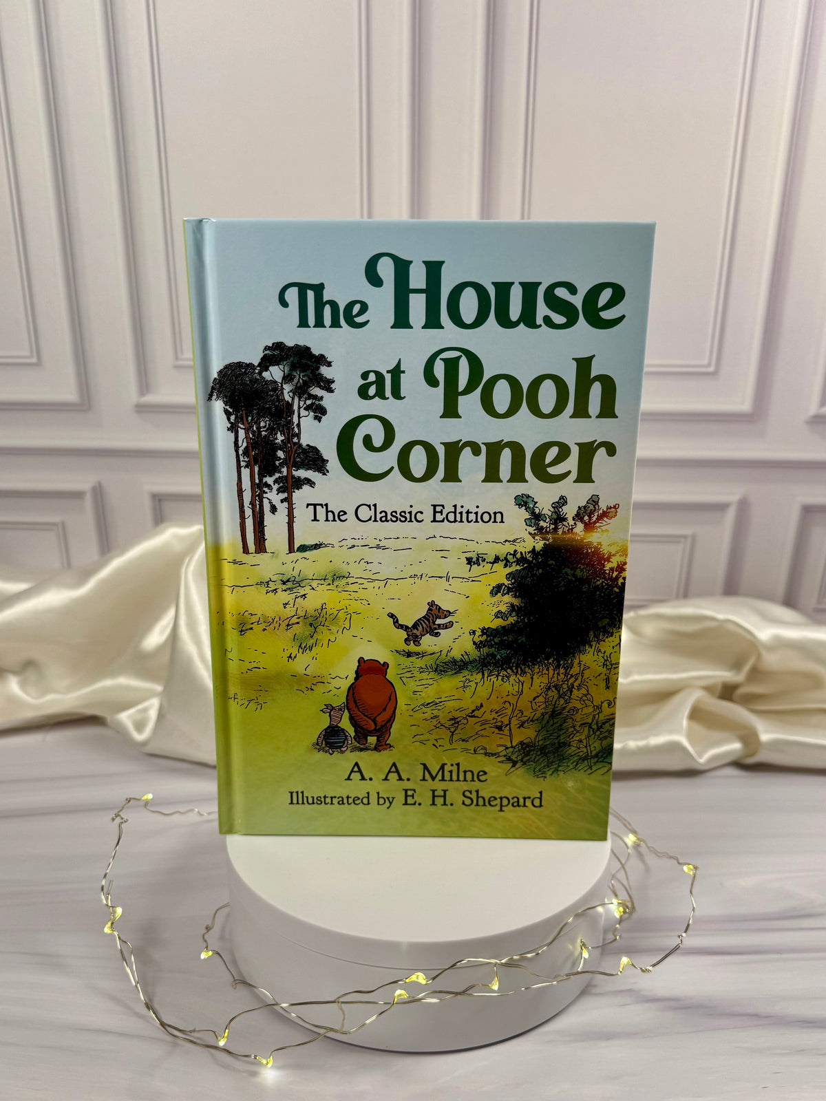 The House at Pooh Corner by A. A. Milne, Skyhorse illustrated hardcover edition with a green cover featuring classic E. H. Shepard Winnie-the-Pooh artwork.