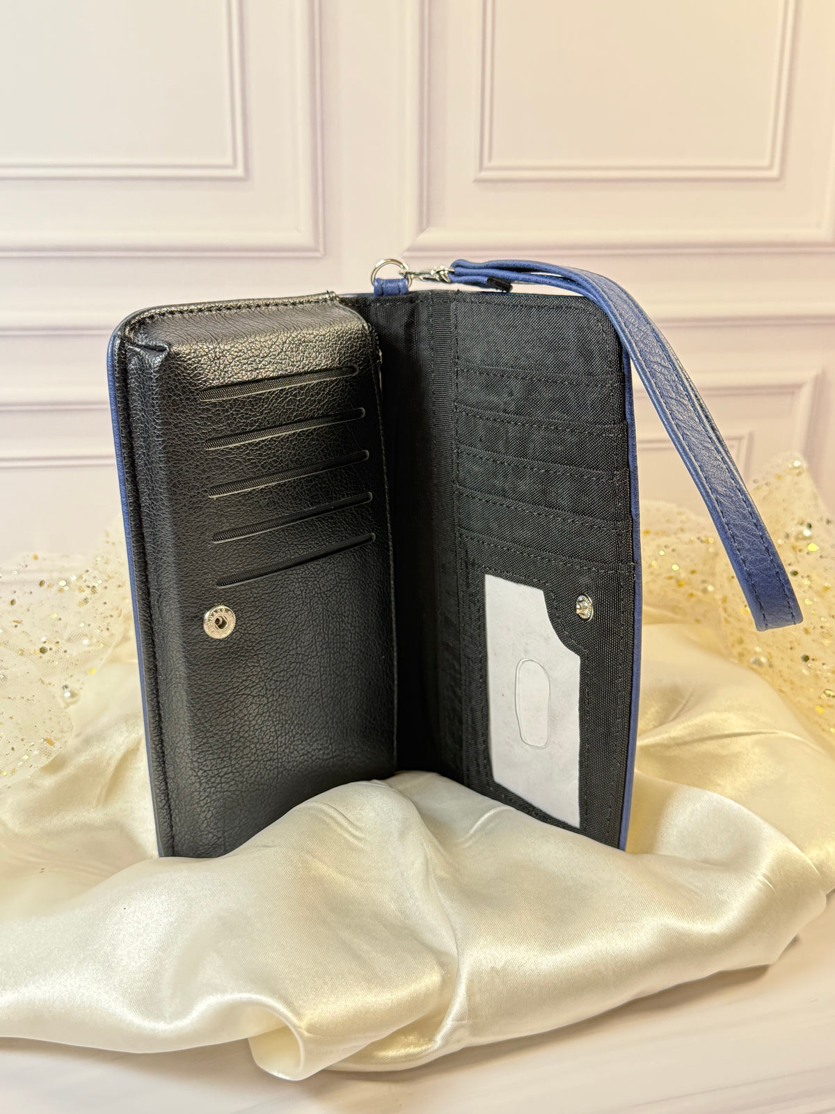 Open Snow White book wallet showing card slots, ID window, zippered pocket, and interior organization.