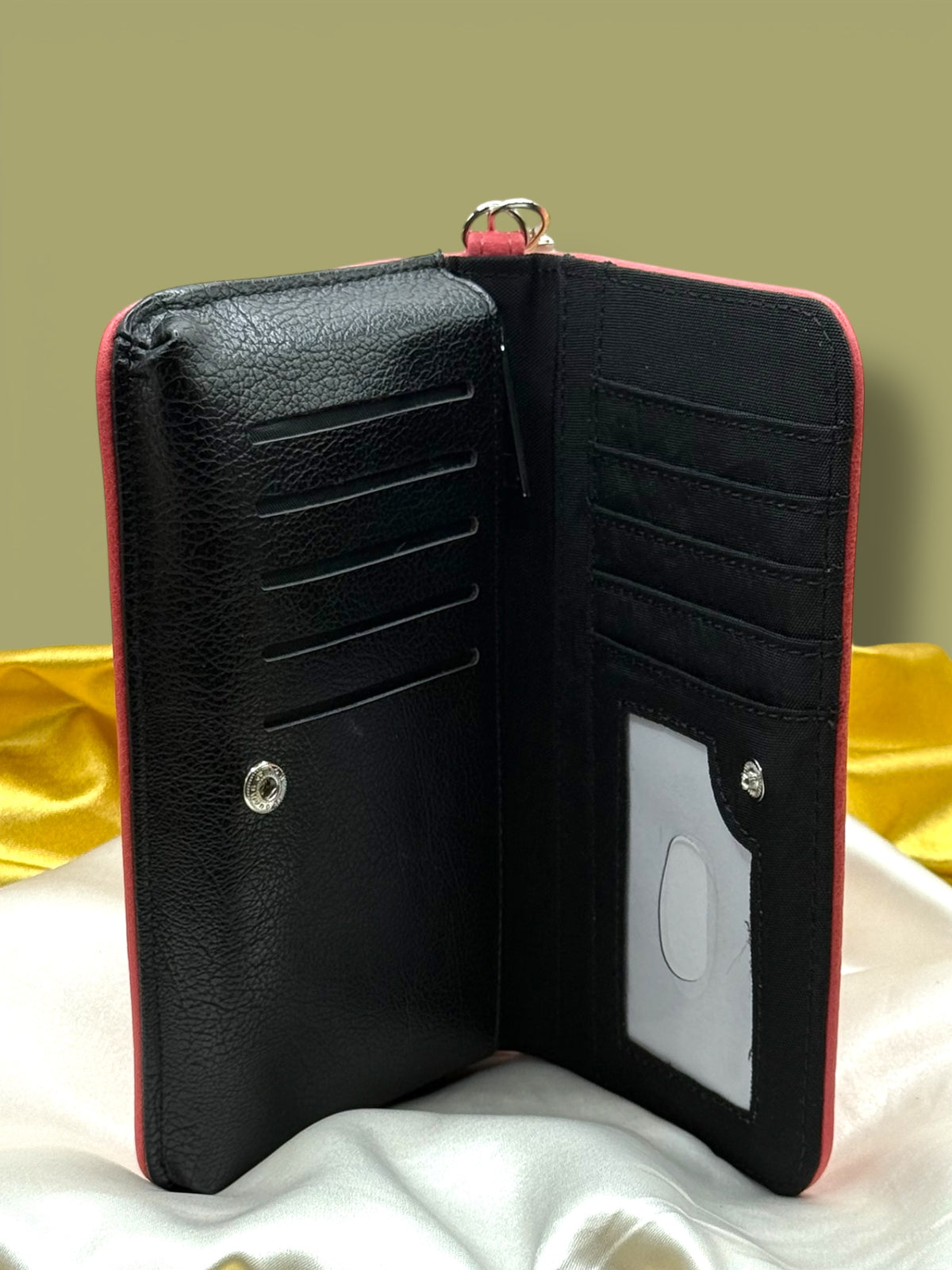 Open Emma Book Wallet showing its black interior with multiple card slots and compartments for organizing cards, cash, and small essentials.