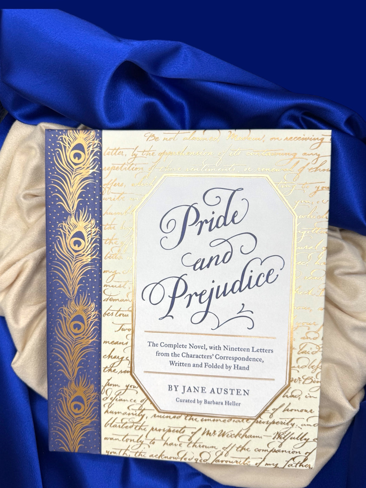 Alternate front view of Pride and Prejudice deluxe edition, featuring its illustrated cream cover panel and ornate blue and gold floral border.