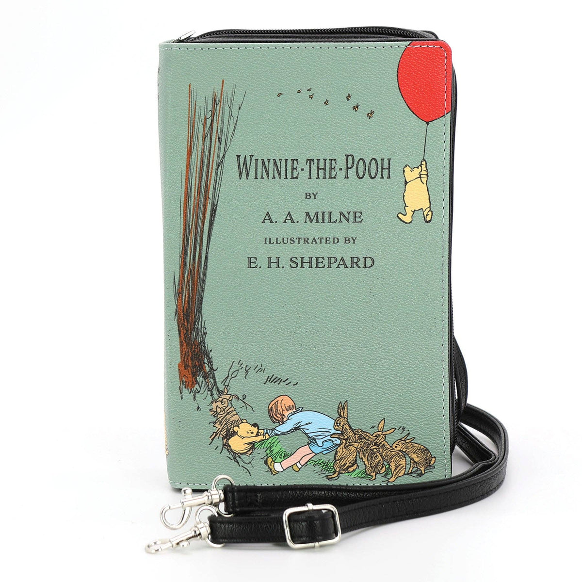 The House at Pooh Corner Winnie-the-Pooh book clutch bag in green vinyl, featuring illustrated A. A. Milne book-cover artwork and a zippered book-shaped purse design.
