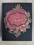 Jane Austen Complete Novels, Wordsworth Library Collection large hardcover book with black linen cloth binding, decorative gold foil details, colored page edges, and ribbon bookmark.