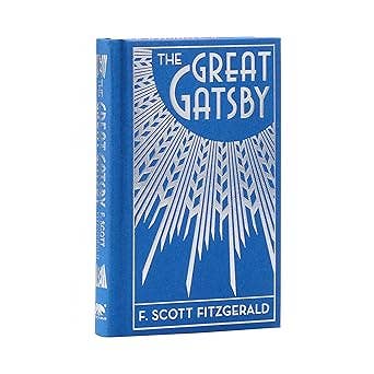 The Great Gatsby by F. Scott Fitzgerald, Arcturus Ornate Classics pocket-sized hardcover edition with silver-embossed cover, silver-gilded page edges, and decorative endpapers.
 Copy alt text