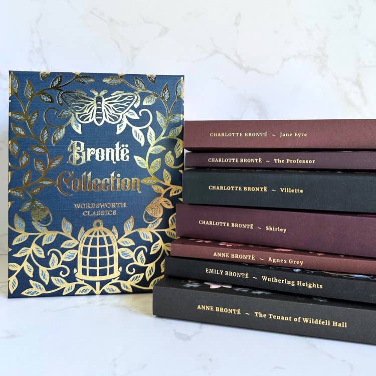 The Brontë Collection seven-book box set by Charlotte, Emily, and Anne Brontë, featuring illustrated book covers and a decorative slipcase with gold detailing.