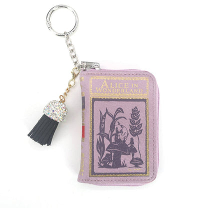 Alice in Wonderland miniature book-shaped vinyl coin purse and bag charm featuring vintage-style storybook cover artwork inspired by Lewis Carroll&