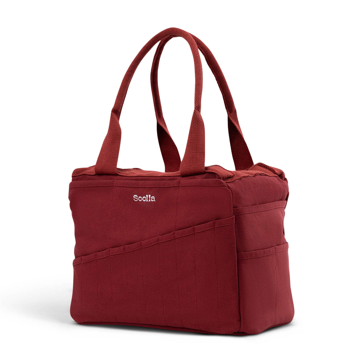 Soolla Studio Bag in Sangria, angled view showing the canvas body and storage pockets.
