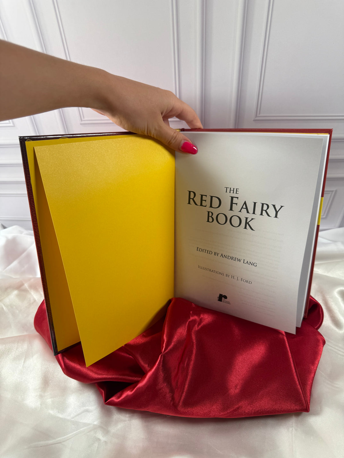 The Red Fairy Book opened to its title page, featuring Andrew Lang&