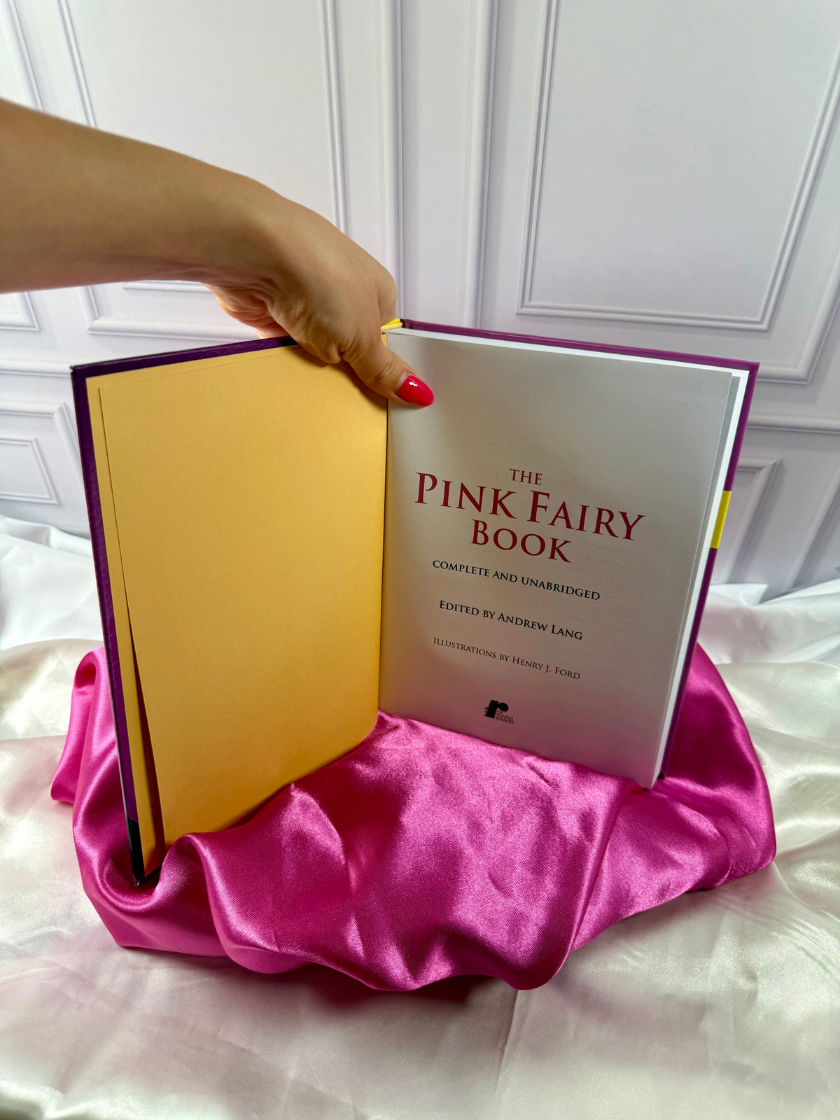 The Pink Fairy Book opened to its title page, showing Andrew Lang&