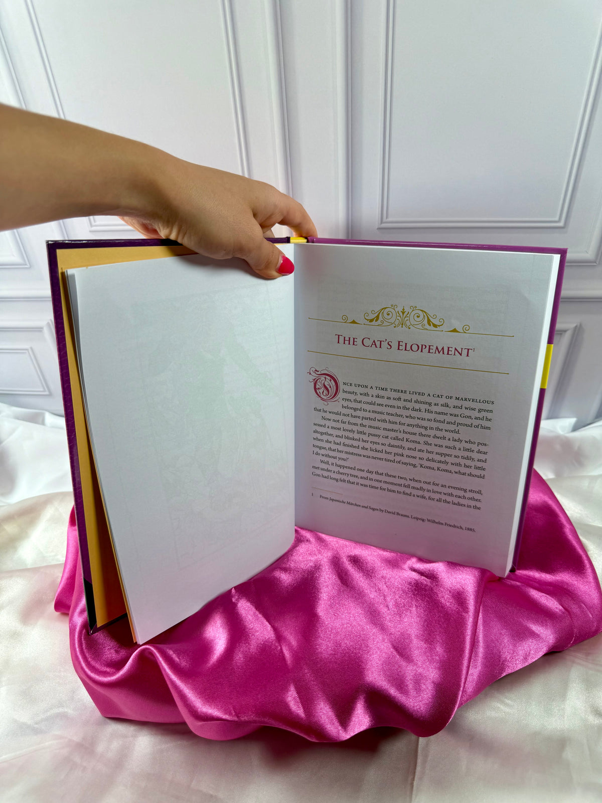 Interior story pages of The Pink Fairy Book by Andrew Lang, showing a classic fairy tale with decorative typography.