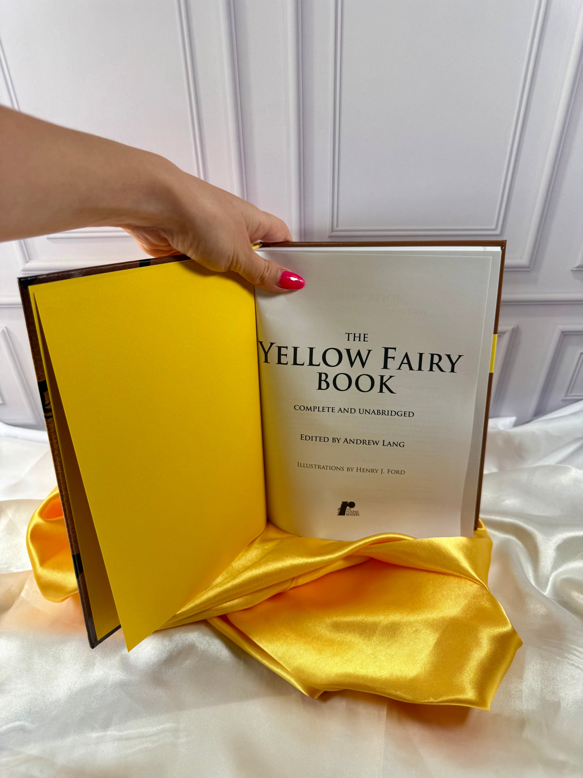 The Yellow Fairy Book opened to its title page, showing Andrew Lang&