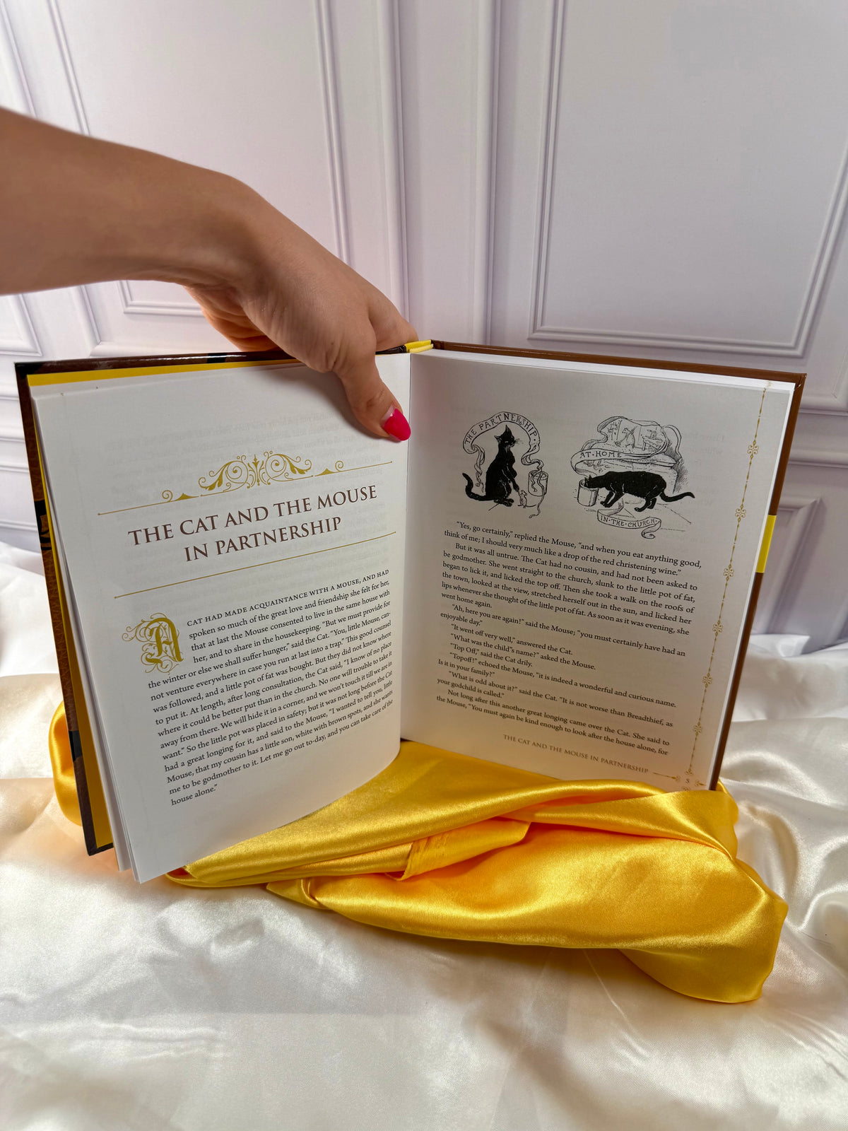 Interior story pages of The Yellow Fairy Book by Andrew Lang, showing a traditional fairy tale with decorative typography.