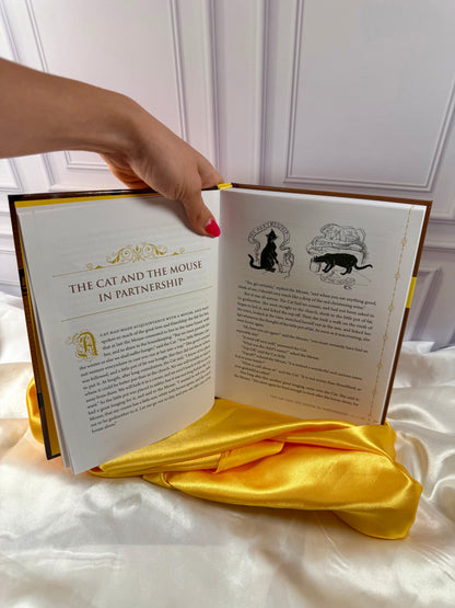 Interior story pages of The Yellow Fairy Book by Andrew Lang, showing a traditional fairy tale with decorative typography.
