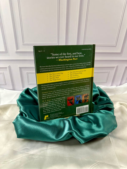 Back cover of The Green Fairy Book by Andrew Lang showing its fairy tale descriptions, featured stories, and publisher information.