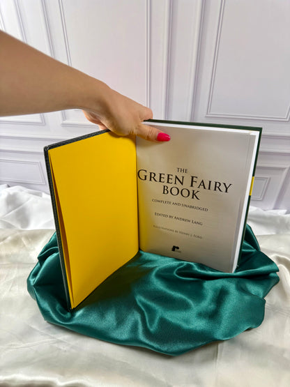 The Green Fairy Book opened to its title page, edited by Andrew Lang and illustrated by Henry J. Ford, with yellow endpaper visible.