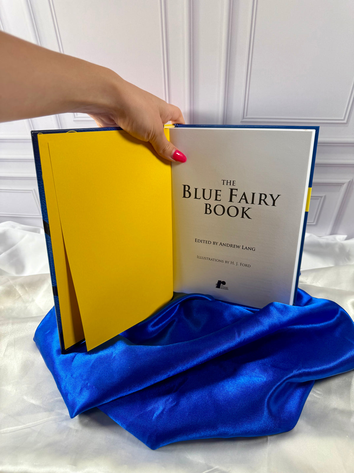 The Blue Fairy Book opened to its title page, showing Andrew Lang&