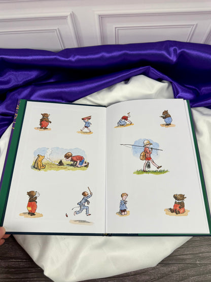 Now We Are Six hardcover opened to colorful E. H. Shepard illustrations of Christopher Robin and Winnie-the-Pooh playing, walking, and exploring.