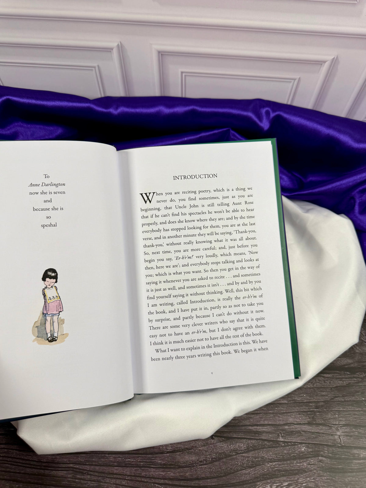 Interior of Now We Are Six by A. A. Milne showing the Introduction opposite the dedication to Anne Darlington and a color illustration by E. H. Shepard.