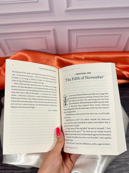Interior reading pages from the Mary Poppins paperback collection by P. L. Travers, featuring classic story text and black-and-white illustrations.