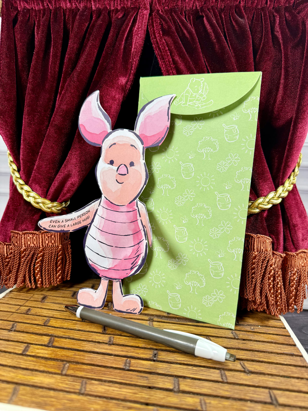 Disney Winnie the Pooh Hugs Piglet character notecard shown folded with its arms enclosing a handwritten greeting.