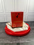Mary Poppins Collection hardcover treasury by P. L. Travers, red decorative cover displayed on a black book stand with red and ivory satin fabric.
