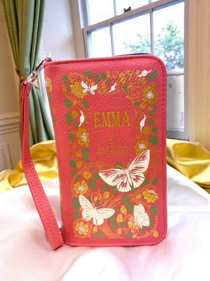 Emma by Jane Austen literary book wallet shown against a white background, featuring a pink floral cover design and matching wristlet strap.