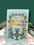 Sense and Sensibility by Jane Austen, Wordsworth Classics paperback with a pale mint-green cover, orange lettering, and decorative botanical illustration, displayed on ivory satin.