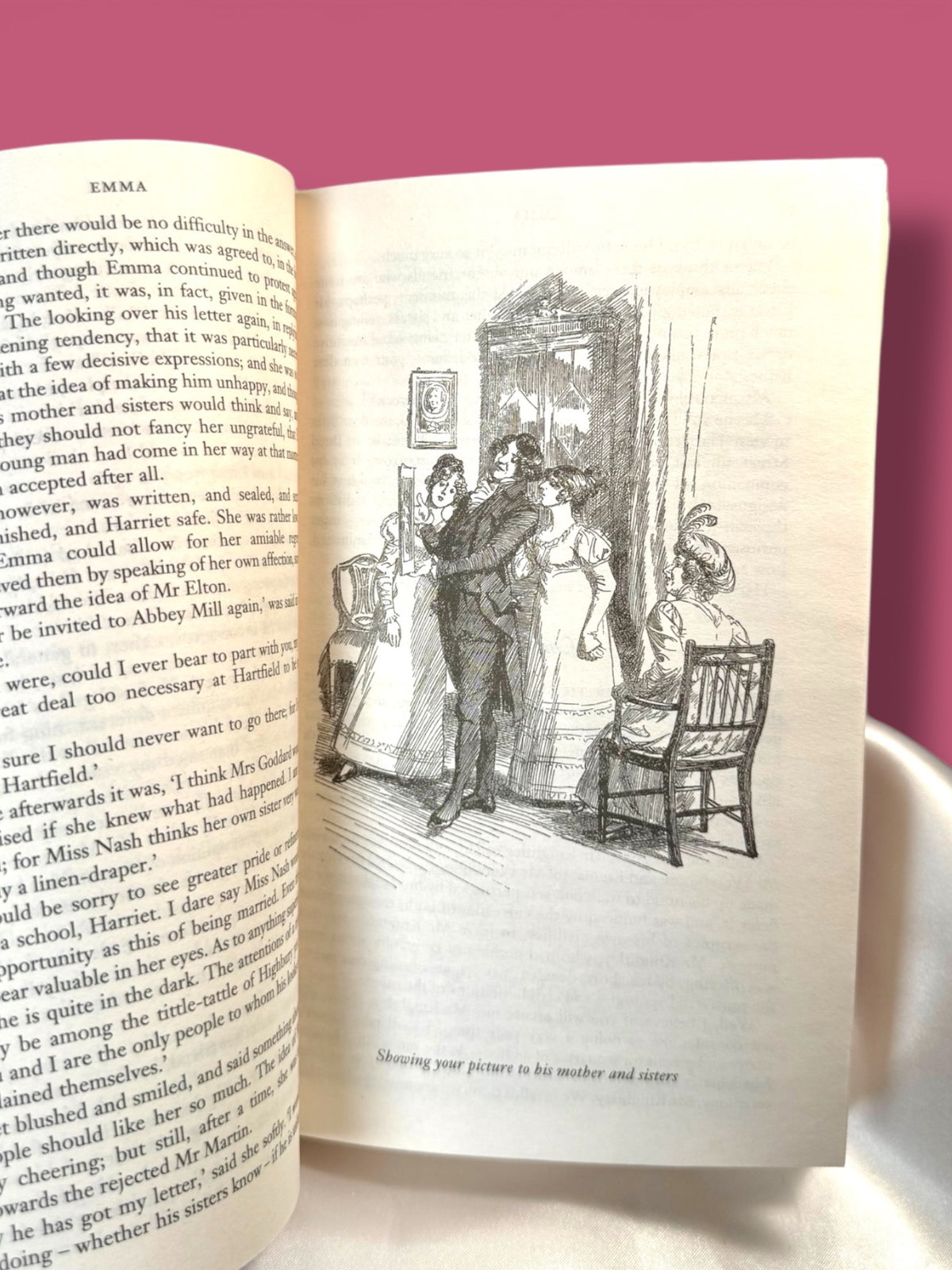 Open Emma by Jane Austen Wordsworth Classics paperback displaying printed text and a black-and-white illustration inside the book.