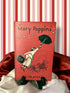 Mary Poppins by P. L. Travers, classic jacketed hardcover edition featuring red cover artwork of Mary Poppins floating through the air beneath her umbrella.
