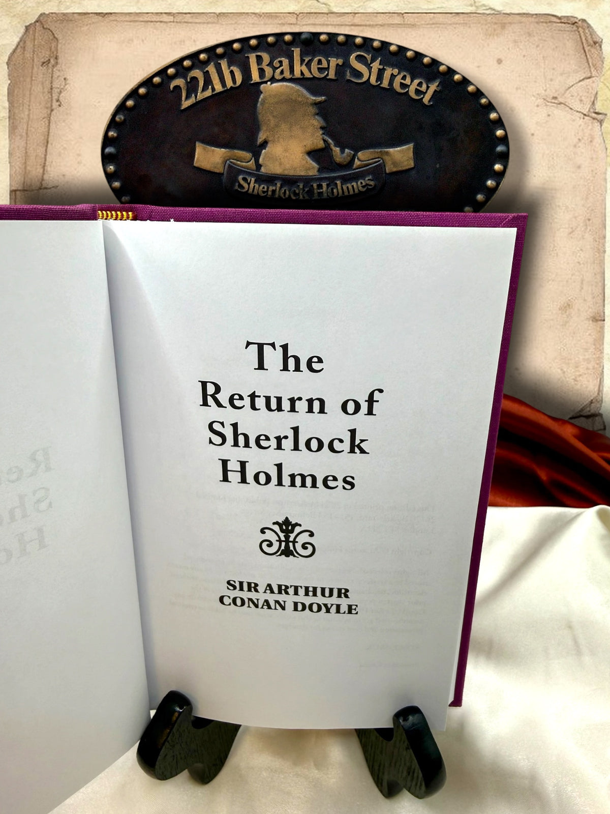 Interior title page of The Return of Sherlock Holmes by Sir Arthur Conan Doyle, photographed inside the purple clothbound hardcover edition.