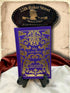 His Last Bow by Sir Arthur Conan Doyle, purple clothbound Sherlock Holmes hardcover with elaborate gold floral decoration, displayed beneath a 221B Baker Street sign.