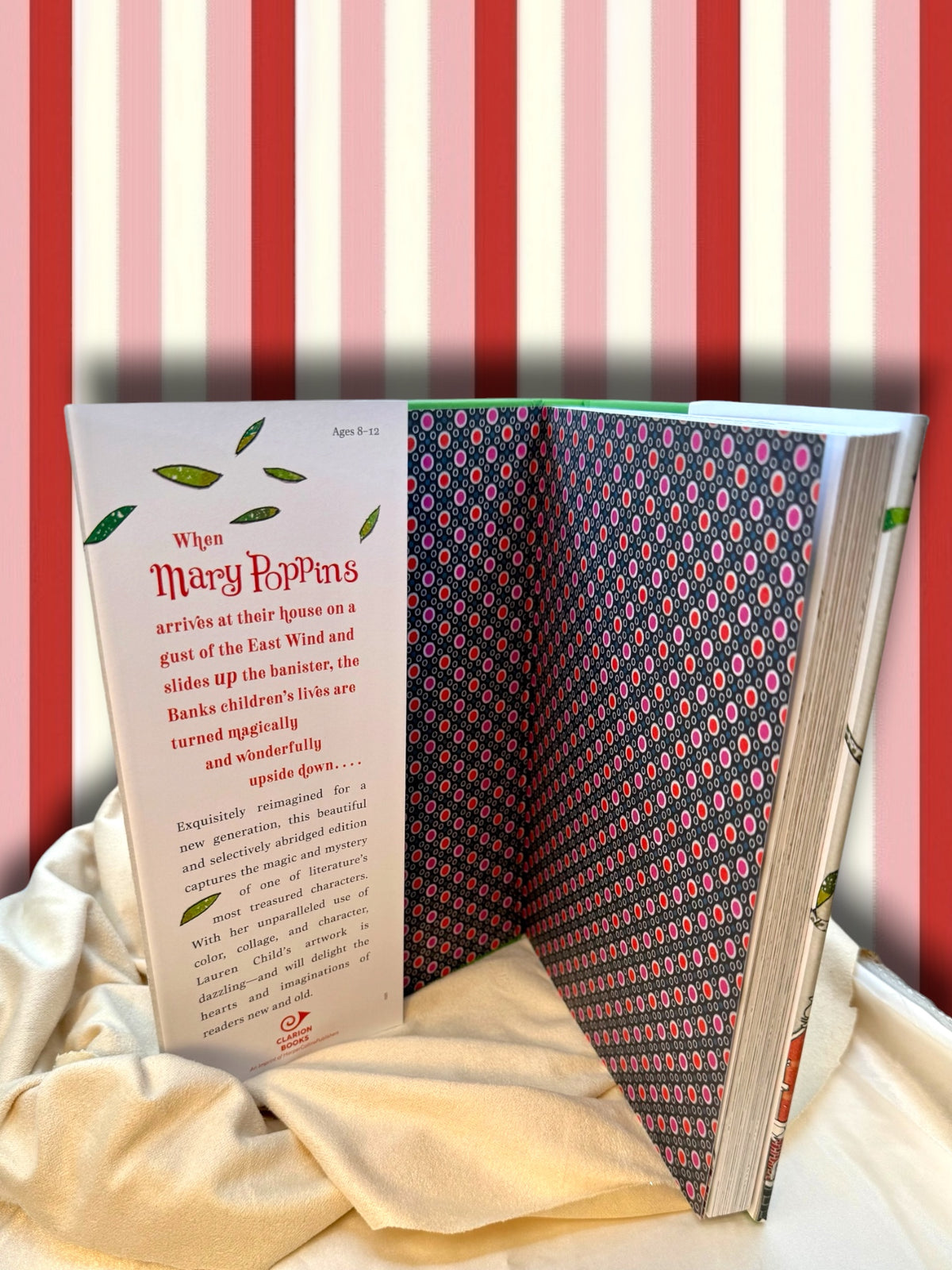 Mary Poppins illustrated Gift Edition opened to its decorative endpapers, featuring colorful artwork by Lauren Child.