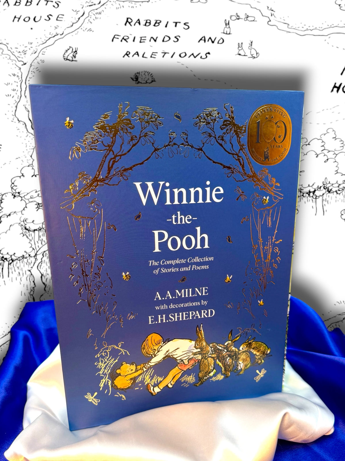 Winnie-the-Pooh: The Complete Collection by A. A. Milne, large blue slipcased hardcover omnibus containing four classic works illustrated by E. H. Shepard, photographed at StoryGiftStudio™.