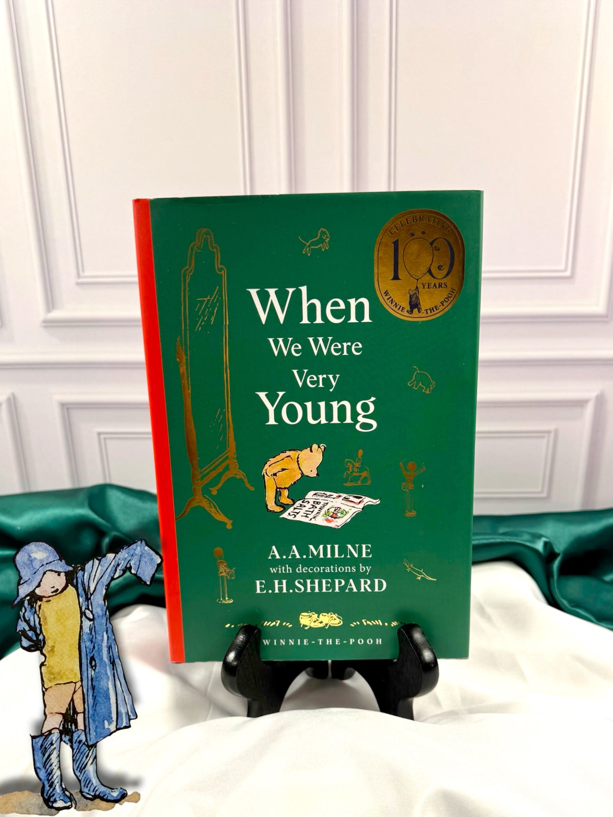 When We Were Very Young by A. A. Milne, 100th anniversary illustrated hardcover with green cover, red spine, gold anniversary emblem, and E. H. Shepard artwork.