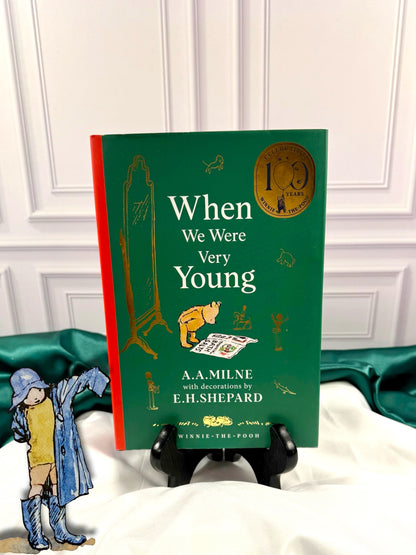 When We Were Very Young by A. A. Milne, 100th anniversary illustrated hardcover with green cover, red spine, gold anniversary emblem, and E. H. Shepard artwork.