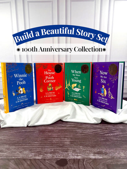 Winnie-the-Pooh 100th Anniversary Collection featuring four illustrated A. A. Milne hardcovers: Winnie-the-Pooh, The House at Pooh Corner, When We Were Very Young, and Now We Are Six.