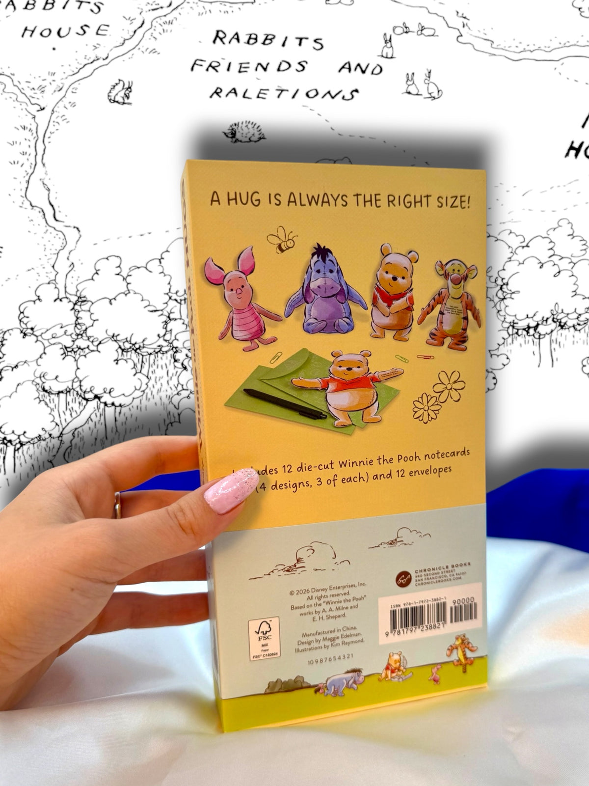 Back of Disney Winnie the Pooh Hugs stationery package showing product information and illustrations of the folding character notecards.