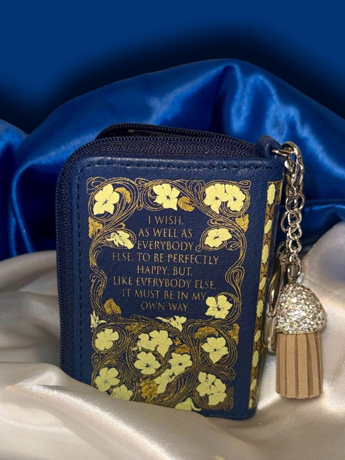 Back of Sense and Sensibility book bag charm featuring a Jane Austen quotation framed by gold floral artwork, with silver keyring and decorative tassel.