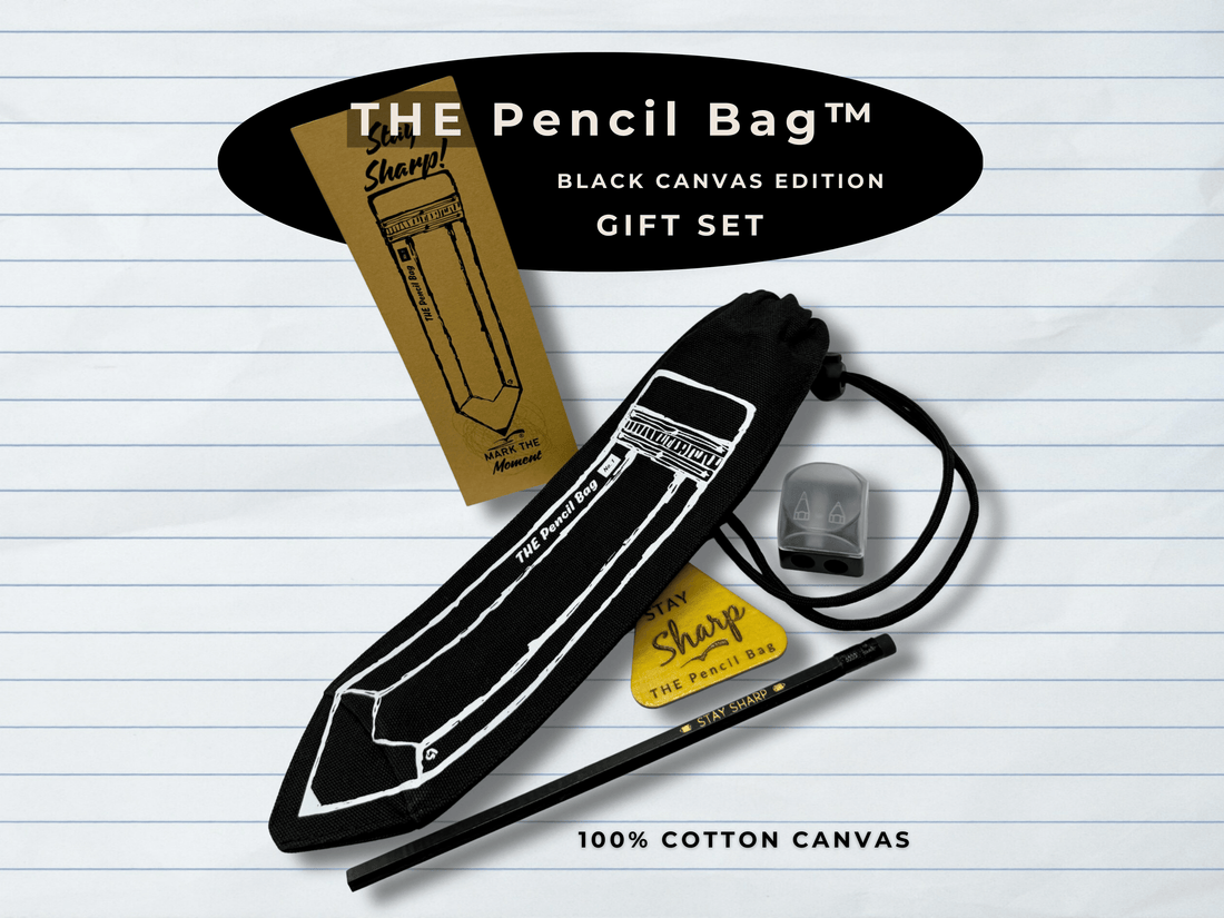 Black canvas pencil bag with sharpener and pen on lined paper background