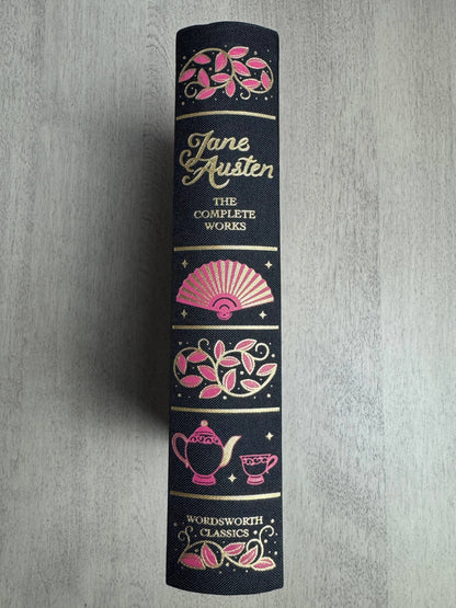 Jane Austen book set with decorative cover on a gray background