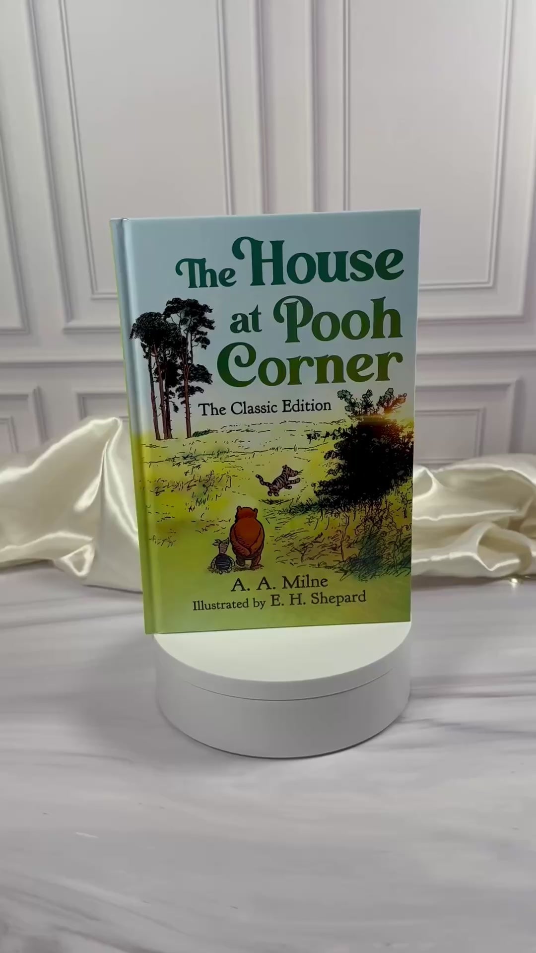 Video preview of The House at Pooh Corner illustrated hardcover edition, showing the book's exterior and interior pages.