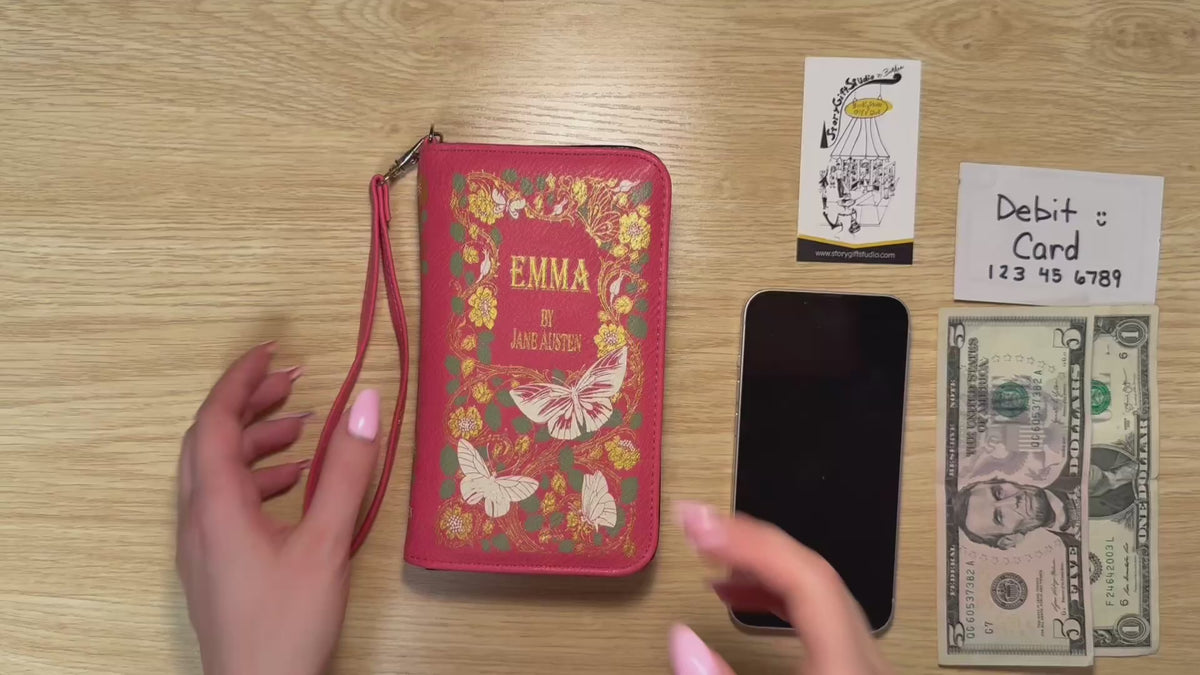 Video showcasing the Jane Austen Emma Book Wallet, highlighting its decorative literary cover, compact shape, and wristlet design.